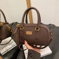Retro dark brown Boston handbag with golden hardware and adjustable crossbody strap - Coffee without Pendant