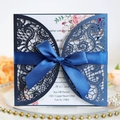 Elegant navy blue laser cut wedding invitation with floral insert and silk bow - Magic Blue
