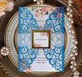 Macro view of laser-cut wedding invitation with glitter detail and floral inner card - Glitter Royal Blue