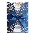 Navy laser-cut wedding invitation with blue satin bow and floral inner page - Magic Blue