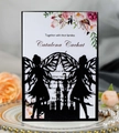 Macro detail of laser-cut black fairy and castle silhouette wedding invitation - Black