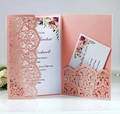 Detail of rose gold laser-cut floral wedding invitation with RSVP card and inner sheet - Pink