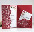 Detail of laser-cut hollow pattern on burgundy wedding invitation with floral insert - Pearlescent Red