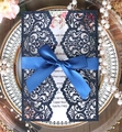 Detail of laser-cut glitter navy blue invitation with elegant satin bow and floral inner - Glitter Dark Blue