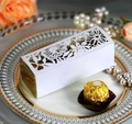 Detail of laser-cut hollow rose white gift box with gold liner on decorative plate - White