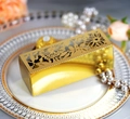 Detail of laser-cut gold floral hollow candy box with metallic finish for chocolates - Reflective Gold