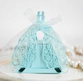 Close-up of laser-cut peacock wedding favor box in light blue with white ribbon bow - Pearl Pale Blue