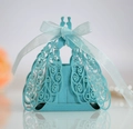 Detailed laser-cut peacock pattern on light blue favor box with ribbon bow and soft reflection - Tiffany Blue