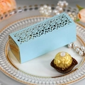 Close-up of light blue laser-cut gift box with floral patterns on a golden tray - Pearl Pale Blue