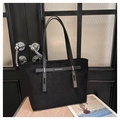 Detail of black matte large tote bag with central strap and silver metal hardware buckle - Black
