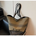 Detail of olive green canvas tote bag showing the black ZYS logo and striped patterns - Green