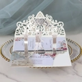 Detail showing 3D laser-cut wedding invitation with intricate lace floral patterns - Reflective Silver
