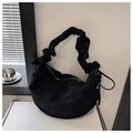 Detail of black crescent bag featuring ruffled shoulder strap and drawstring accents - Black