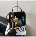 Detail of leopard print flap and teddy bear charm on black vintage backpack for women - Black with Pendant