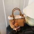 Brown suede bucket bag with white faux shearling trim and plush heart charms - With Charm / Brown
