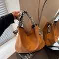 Deep brown faux suede tote bag featuring distinctive black and white woven rope handles - Brown