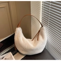 Detailed macro view of white faux fur texture and brown leather strap on hobo bag - Off White