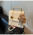 Detail of cream white PU backpack with gold star buckle and cute plush bear charm - With Charm / Off White