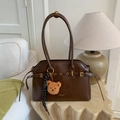 Vintage dark brown leather handbag with gold logo and cute bear charm accessory - Brown with Pendant