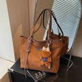 Brown frosted leather tote bag with a cute plush bear pendant for daily commuting - With Charm / Brown