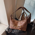 Retro brown underarm bag in polished synthetic leather with golden horse-bit hardware details - Brown