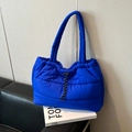 Quilted royal blue puffer tote bag with adjustable drawstring and sleek wide handles - Blue Without Charm