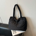 Black quilted puffer tote bag with wide padded straps and adjustable drawstring closure - Black without Pendant