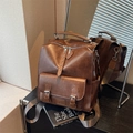 Vintage brown leather backpack with adjustable straps and front buckle pocket - Brown