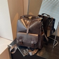 Retro dark brown backpack in polished synthetic leather with front buckle pocket and handle - Brown