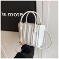 Detail of white pleated leather bucket bag with circular handles and adjustable strap - White