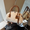 Chic white faux fur Boston bag with brown leather handles and adjustable shoulder strap - Off-white