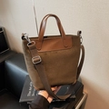 Vintage τσάντα bucket από χακί σουέτ με καφέ δερμάτινες λαβές και φαρδύ ιμάντα ώμου - Πράσινο