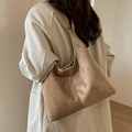 Brown matte faux leather hobo shoulder bag shown on model for daily minimalist style - Khaki