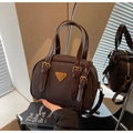 Retro dark brown matte crossbody bag with glossy handles and metallic buckle details - Brown