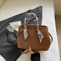 Brown litchi grain shoulder bag with decorative scarf handle and adjustable strap - Biscuit