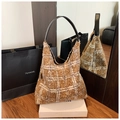 Detail of checkered brown wool tote bag with soft plush texture and black leather handle - Brown Plaid