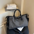 Gray striped travel duffel bag with black leather trim and adjustable shoulder strap - Black