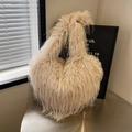 Plush faux fur tote bag in creamy beige featuring a stylish tassel and heart shape design - Beige