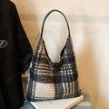 Classic black and white plaid wool blend shoulder bag with black leather handle on books - Large Grid