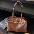 Bolso tote vintage de cuero caramelo con elegante hebilla dorada y doble asa - Marrón