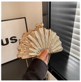 Detailed view of a gold shell-shaped acrylic clutch with radial texture and metal clasp - Basic Style (C032) / Gold