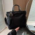 Classic black nylon bucket bag with adjustable wide strap and Clear Ok label - Black