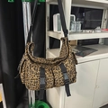 Leopard print canvas tote bag featuring double front buckle pockets and black strap - Brown