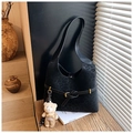 Close-up of black leopard embossed suede bucket bag with decorative belt and bear charm - With Charm / Black