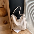 Minimalist beige matte hobo bag with dual zipper detail and adjustable long straps - Light Khaki