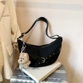 Black hobo shoulder bag with buckle strap and plush puppy charm on luggage - With Charm / Black
