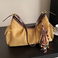 Khaki suede hobo bag with ethnic tassel and brown leather strap in a vintage style - Camel With Charms