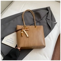 Brown woven texture tote bag with stylish beaded tassel detail on grey blazer - Khaki With Pendant