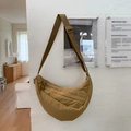 Detail view of khaki crescent quilted crossbody bag with adjustable wide strap and metal buckle - Khaki