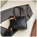 Detail of black woven texture tote bag with colorful wooden bead tassel decoration - Black With Pendant